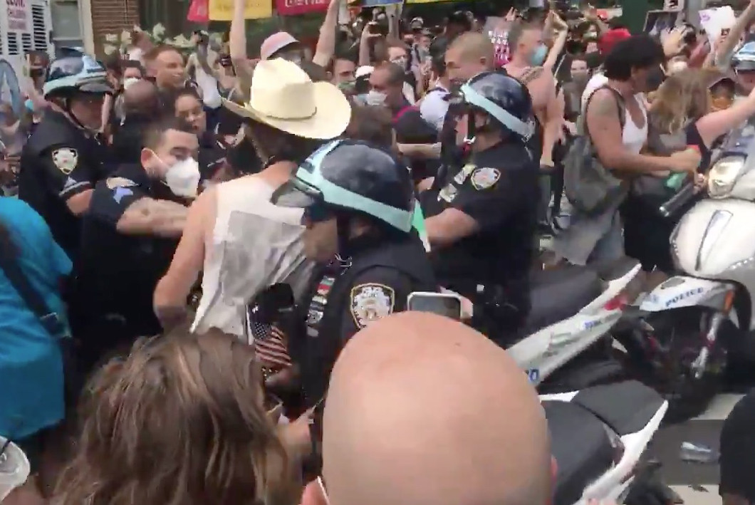 Violent Motorcycle Cop Drives into Crowd