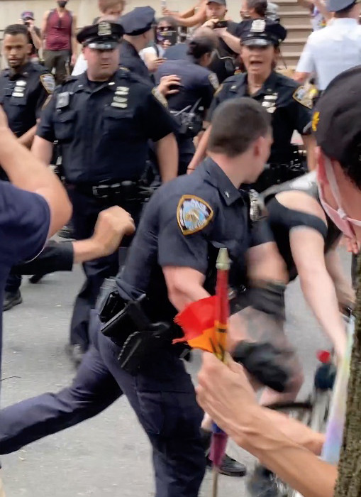 Violent Cop Grabs Bike & Throws it to the Ground into Crowd